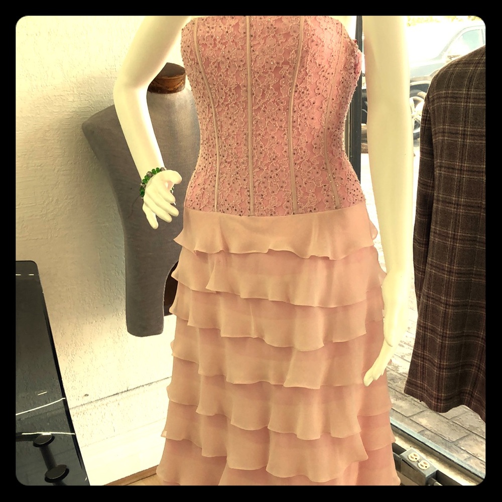 Pink evening gown dress with lace and ruffles.